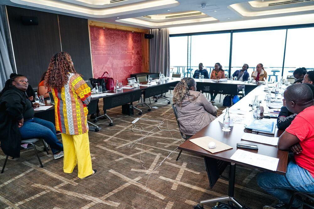 Mel facilitating a workshop for a group